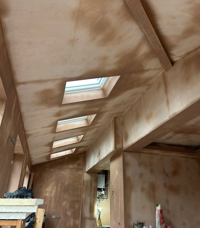 Plastering work across an interior with rooflights