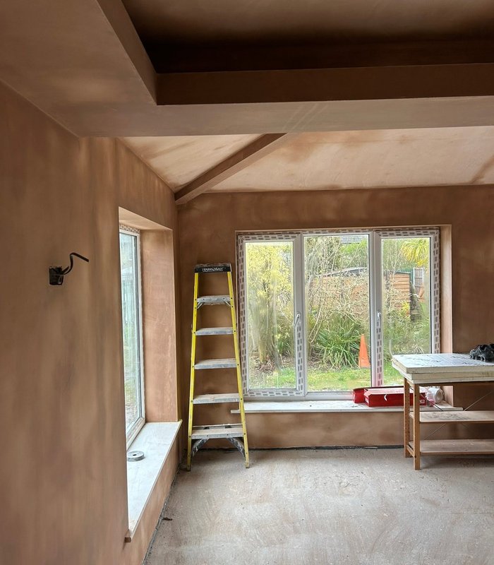 Freshly plastered room with a large window