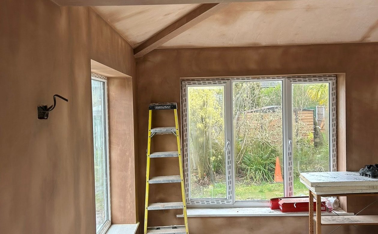 Freshly plastered room with a large window